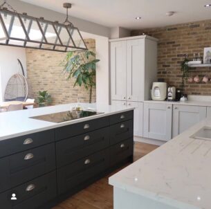 sleek modern kitchen with brick walls
