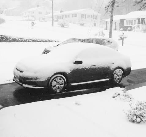 car on melted driveway square